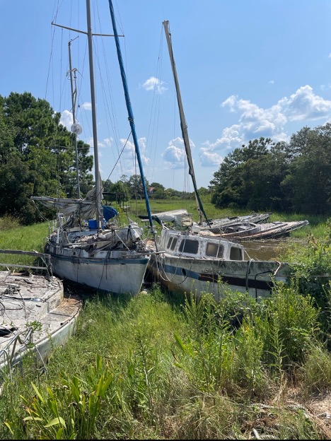 Derelict sailboats located in coastal Mississippi.